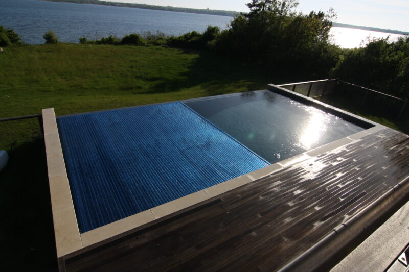Covertech Grando Rigid Slatted free form Pool Cover trackless no pumps energy efficient increasing safety Connetticut California Florida Mexico