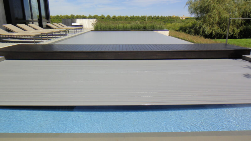 Covertech Grando Rigid Slatted free form Pool Cover trackless no pumps energy efficient increasing safety Connetticut California Florida Mexico